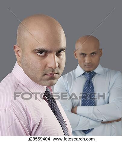 Portrait of two bald executives View Large Photo Image Picture - Portrait of two bald executives . Fotosearch