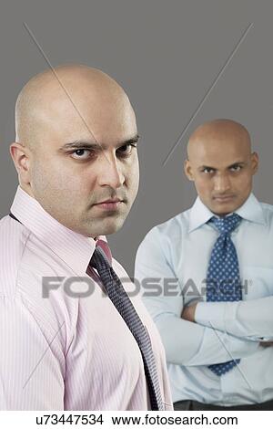 Portrait of two bald executives View Large Photo Image Picture - Portrait of two bald executives . Fotosearch