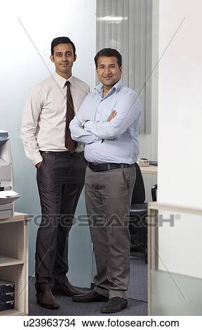Portrait of two executives in an office View Large Photo Image Picture - Portrait of two executives in an office. Fotosearch