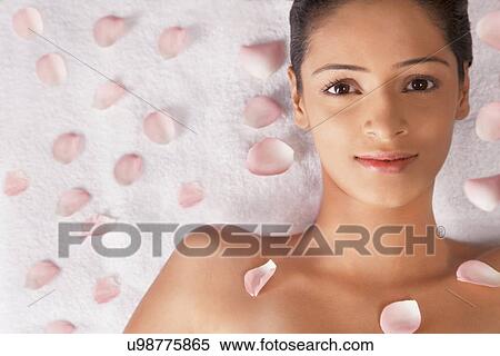 Portrait of woman lying on massage table with petals View Large Photo Image Stock Photography - Portrait of woman lying on massage table with petals . Fotosearch