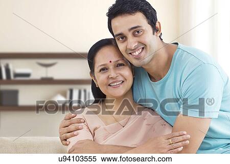Portrait of young man hugging his mother View Large Photo Image Stock Photography - Portrait of young man hugging his mother . Fotosearch