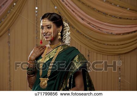 Stock Photograph - Pretty young bride smiling . Fotosearch