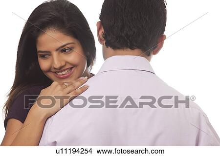 Rear view of a woman smiling View Large Photo Image Picture - Rear view of a woman smiling. Fotosearch