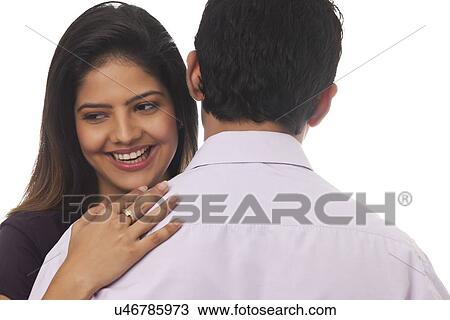 Rear view of a woman smiling View Large Photo Image Stock Image - Rear view of a woman smiling. Fotosearch