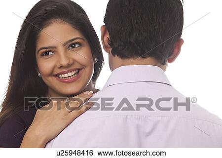 Rear view of a woman smiling View Large Photo Image Stock Photograph - Rear view of a woman smiling. Fotosearch