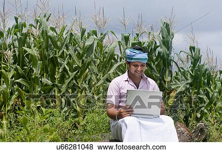 Rural man with a laptop View Large Photo Image Stock Photo - Rural man with a laptop . Fotosearch
