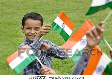 School boy holding the Indian Flag View Large Photo Image Stock Image - School boy holding the Indian Flag . Fotosearch