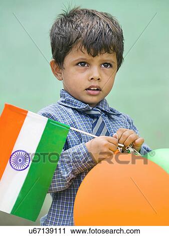 School boy holding the Indian flag View Large Photo Image Stock Image - School boy holding the Indian flag . Fotosearch