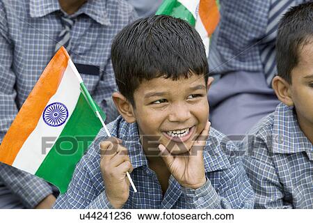 School boy holding the Indian flag View Large Photo Image Stock Photograph - School boy holding the Indian flag . Fotosearch