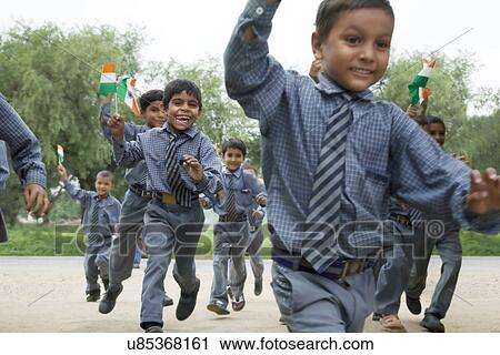 School boys running with the Indian flag View Large Photo Image Stock Image - School boys running with the Indian flag . Fotosearch