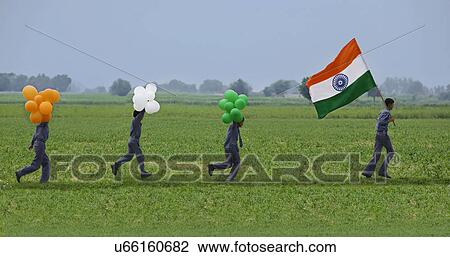 Stock Image - School boys with the Indian Flag and balloons . Fotosearch
