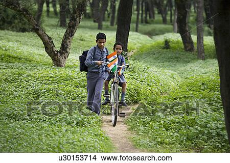 School kids passing through a jungle View Large Photo Image Picture - School kids passing through a jungle . Fotosearch