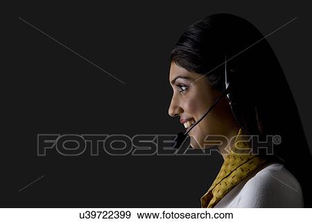 Stock Photo - Secretary with headphones and mic . Fotosearch
