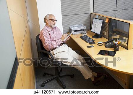 Senior executive making notes View Large Photo Image Stock Image - Senior executive making notes. Fotosearch