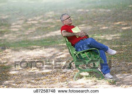Senior man on a bench thinking View Large Photo Image Stock Photo - Senior man on a bench thinking. Fotosearch