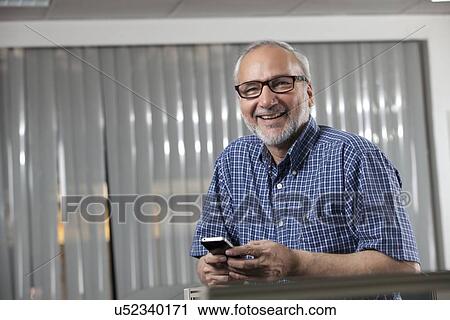 Senior man with a mobile phone View Large Photo Image Stock Image - Senior man with a mobile phone. Fotosearch