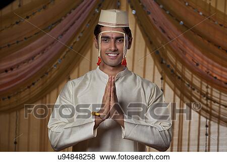 Stock Photo - Smiling Maharashtrian groom doing Namaste . Fotosearch