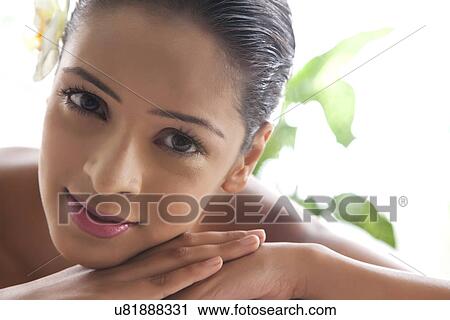 Stock Image - Smiling pretty woman at spa . Fotosearch