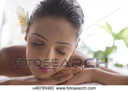 Smiling woman with eyes closed at spa View Large Photo Image Stock Image - Smiling woman with eyes closed at spa . Fotosearch
