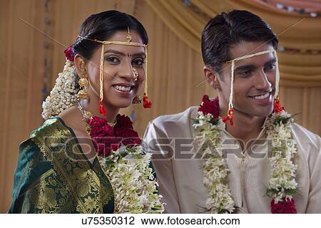 Smiling young newlywed couple View Large Photo Image Stock Image - Smiling young newlywed couple . Fotosearch