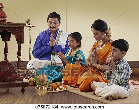 Picture - South Indian family praying . Fotosearch