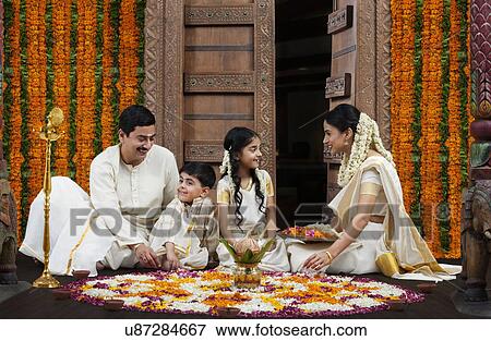 South Indian family with flower rangoli View Large Photo Image Stock Photo - South Indian family with flower rangoli . Fotosearch