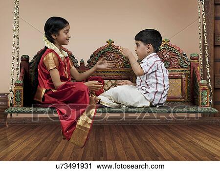 South Indian girl playing with her brother View Large Photo Image Stock Image - South Indian girl playing with her brother . Fotosearch