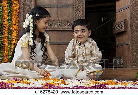 South Indian girl sitting with her brother View Large Photo Image Stock Image - South Indian girl sitting with her brother . Fotosearch