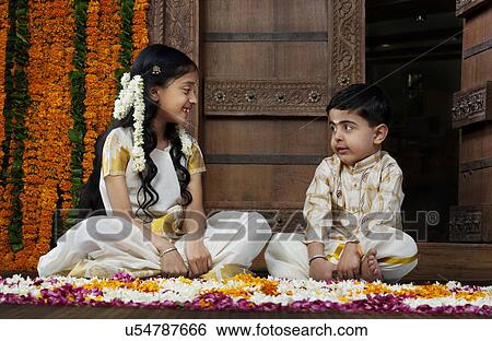 South Indian girl sitting with her brother View Large Photo Image Stock Photograph - South Indian girl sitting with her brother . Fotosearch