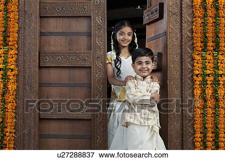 South Indian girl standing with her brother View Large Photo Image Stock Photo - South Indian girl standing with her brother . Fotosearch