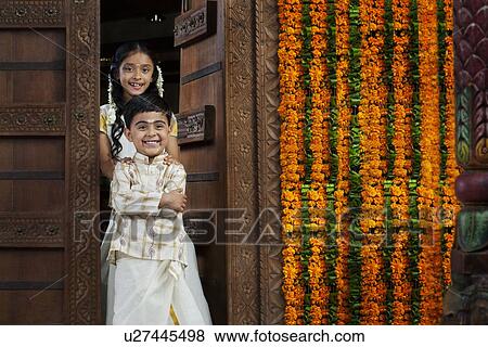 South Indian girl standing with her brother View Large Photo Image Stock Photo - South Indian girl standing with her brother . Fotosearch