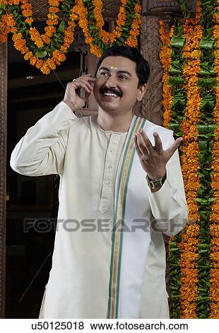 South Indian man talking on a mobile phone View Large Photo Image Stock Photo - South Indian man talking on a mobile phone . Fotosearch