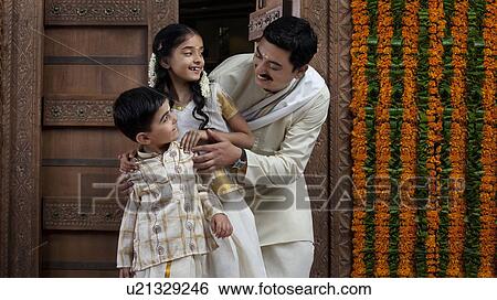 South Indian man with son and daughter View Large Photo Image Stock Photograph - South Indian man with son and daughter . Fotosearch