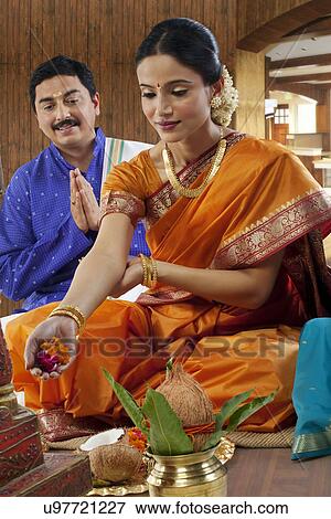 South Indian woman making an offering View Large Photo Image Stock Photo - South Indian woman making an offering . Fotosearch