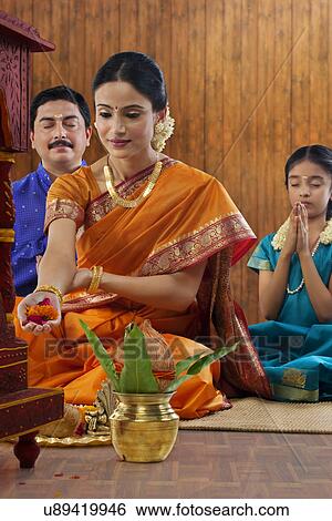 South Indian woman making an offering View Large Photo Image Stock Photograph - South Indian woman making an offering . Fotosearch