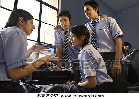 Students discussing in a computer lab View Large Photo Image Stock Photo - Students discussing in a computer lab . Fotosearch