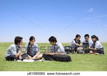 Students sitting in the garden of a school View Large Photo Image Stock Photography - Students sitting in the garden of a school . Fotosearch