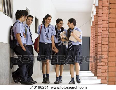 Students walking in the corridors of a school View Large Photo Image Stock Image - Students walking in the corridors of a school . Fotosearch