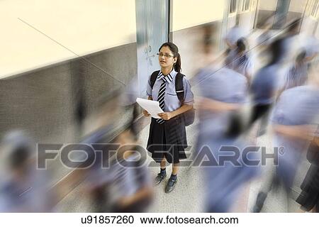 Students walking past a school girl View Large Photo Image Stock Image - Students walking past a school girl . Fotosearch