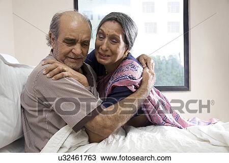 Wife embracing her husband at the hospital View Large Photo Image Stock Image - Wife embracing her husband at the hospital . Fotosearch
