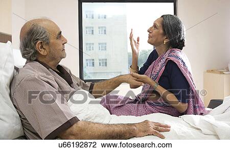 Stock Image - Wife thanking God for her husband's well being . Fotosearch