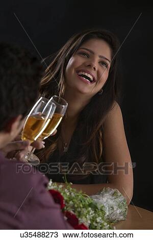 Woman enjoying a glass of wine on Valentines Day View Large Photo Image Stock Image - Woman enjoying a glass of wine on Valentines Day. Fotosearch