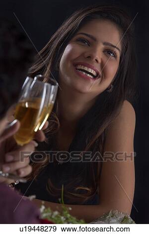 Woman enjoying a glass of wine on Valentines Day View Large Photo Image Stock Photo - Woman enjoying a glass of wine on Valentines Day. Fotosearch
