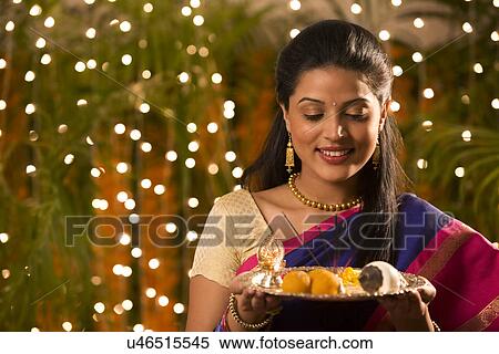 Stock Photography - Woman holding a tray . Fotosearch