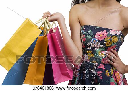 Woman holding shopping bags View Large Photo Image Stock Photograph - Woman holding shopping bags . Fotosearch