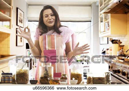 Woman making a face after eating a pickle View Large Photo Image Stock Photograph - Woman making a face after eating a pickle . Fotosearch
