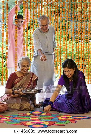 Woman making a rangoli View Large Photo Image Stock Photography - Woman making a rangoli . Fotosearch