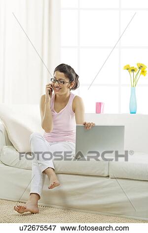 Woman talking on the phone View Large Photo Image Stock Photo - Woman talking on the phone . Fotosearch