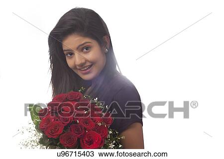 Woman with a bouquet of roses smiling View Large Photo Image Stock Image - Woman with a bouquet of roses smiling. Fotosearch