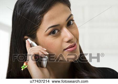 Picture - Woman with a mobile phone . Fotosearch